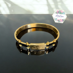 PULSERA DORADA CARTIER NEGRA DE HOMBRE