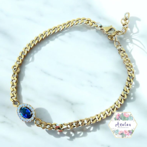 PULSERA DORADA OVALO AZUL