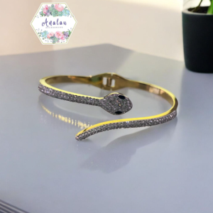 PULSERA SERPIENTE DORADO BLANCO OJOS NEGROS
