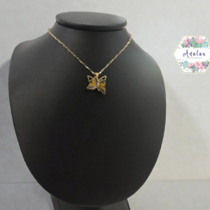 COLLAR MARIPOSA GIRATORIO NEGRO AMARILLO
